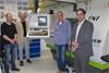 Stephan Metschke, Dr Daniel Hagedorn and Heinz-Peter Heyne in the scientific machine design department at PTB, with Shahram Essam